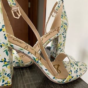 White heels with floral accent